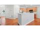 Modern kitchen with stainless appliances, ample counter space, and a view of the entryway at 5669 Cobblestone Creek Pl # 12, Mableton, GA 30126