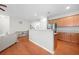 Cozy living room area flowing into the kitchen with hardwood floors and natural light at 5669 Cobblestone Creek Pl # 12, Mableton, GA 30126