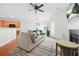Inviting living room features an open layout, hardwood floors, fireplace and seamless transition to the kitchen and dining area at 5669 Cobblestone Creek Pl # 12, Mableton, GA 30126