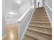 Carpeted staircase leading to the upper level at 5669 Cobblestone Creek Pl # 12, Mableton, GA 30126