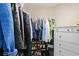 A full walk-in closet with racks and shelves at 5669 Cobblestone Creek Pl # 12, Mableton, GA 30126