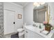 Elegant bathroom features marble countertop, stylish mirror, and patterned shower curtain at 211 Meritage Dr, Alpharetta, GA 30022