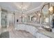 The primary bathroom features double sinks with granite countertops and an enclosed glass shower and freestanding tub at 211 Meritage Dr, Alpharetta, GA 30022