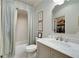 Bathroom featuring marble counters, shower curtain and modern fixtures for a relaxing and luxurious experience at 211 Meritage Dr, Alpharetta, GA 30022