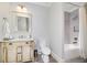 Charming bathroom with a custom vanity, shower and tub combination at 211 Meritage Dr, Alpharetta, GA 30022