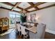 Charming dining room with large windows, stylish chandelier, and elegant furnishings for sophisticated dining at 211 Meritage Dr, Alpharetta, GA 30022
