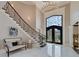 Grand foyer with a staircase, chandelier, high ceilings, and an ornate front door at 211 Meritage Dr, Alpharetta, GA 30022
