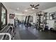 Well-equipped home gym with various machines, free weights, and mirrors, promoting a healthy and active lifestyle at 211 Meritage Dr, Alpharetta, GA 30022