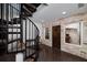 Hallway includes spiral stairs and exposed brick wall with unique decor at 211 Meritage Dr, Alpharetta, GA 30022