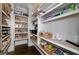 Well-organized pantry with built-in shelves and ample storage space for food and household items at 211 Meritage Dr, Alpharetta, GA 30022