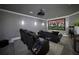 Home theater with plush seating, projector, and large screen, creating the ultimate entertainment experience at home at 211 Meritage Dr, Alpharetta, GA 30022