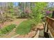 Lush backyard view from the deck, showing landscaped areas and mature trees at 2320 Starr Lake Nw Dr, Acworth, GA 30101