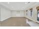 Large finished basement with built-in shelving, concrete flooring, and neutral paint at 2320 Starr Lake Nw Dr, Acworth, GA 30101