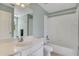Bright bathroom featuring a white single sink vanity and a shower-tub combination at 2320 Starr Lake Nw Dr, Acworth, GA 30101