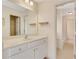 Bathroom featuring white cabinets, countertop, and a large mirror at 2320 Starr Lake Nw Dr, Acworth, GA 30101