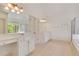 Bathroom with dual sinks, vanities and tiled floor and jacuzzi tub at 2320 Starr Lake Nw Dr, Acworth, GA 30101