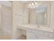 This bathroom features a white single sink vanity and a large mirror with vanity lighting at 2320 Starr Lake Nw Dr, Acworth, GA 30101