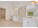 Bathroom featuring dual vanities with a bright window and walk in closet at 2320 Starr Lake Nw Dr, Acworth, GA 30101