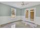 Bedroom with neutral colors, French doors to the backyard, and wainscoting at 2320 Starr Lake Nw Dr, Acworth, GA 30101