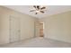 Bedroom featuring a ceiling fan, carpet, and an open door to a hallway at 2320 Starr Lake Nw Dr, Acworth, GA 30101
