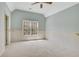 Bedroom with carpeted floors, a ceiling fan, and wainscotting at 2320 Starr Lake Nw Dr, Acworth, GA 30101