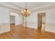 Formal dining room with hardwood floors, paneled walls, and open access to the rest of the home at 2320 Starr Lake Nw Dr, Acworth, GA 30101