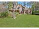 Beautiful two-story home featuring a lush green lawn, complemented by a charming front porch at 2320 Starr Lake Nw Dr, Acworth, GA 30101