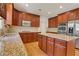 Beautiful kitchen featuring an island, wood cabinets, granite countertops, and stainless appliances at 2320 Starr Lake Nw Dr, Acworth, GA 30101