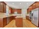 Spacious kitchen with wood cabinets, stainless steel appliances, and a center island, perfect for meal prep at 2320 Starr Lake Nw Dr, Acworth, GA 30101
