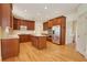 Well-equipped kitchen featuring custom wood cabinets, stainless appliances, and an island at 2320 Starr Lake Nw Dr, Acworth, GA 30101