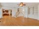 Open-concept living area with hardwood floors, stairs, and a view of the kitchen at 2320 Starr Lake Nw Dr, Acworth, GA 30101