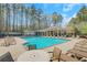 Community pool with lounge chairs and covered seating areas at 2320 Starr Lake Nw Dr, Acworth, GA 30101