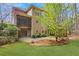 Backyard featuring a patio, screened porch, landscaping, and wooded surroundings at 2320 Starr Lake Nw Dr, Acworth, GA 30101
