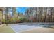 Community tennis court surrounded by mature trees at 2320 Starr Lake Nw Dr, Acworth, GA 30101