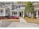 Charming townhome with a well-manicured front yard, covered porch, and neutral siding at 2794 Farmstead Se Rd, Smyrna, GA 30080