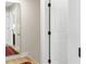 Hallway with large mirror to reflect light and adjacent doorway at 2794 Farmstead Se Rd, Smyrna, GA 30080