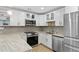 Modern kitchen with granite countertops, stainless steel appliances, and ample storage at 2794 Farmstead Se Rd, Smyrna, GA 30080