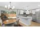 Updated kitchen with white cabinets, stainless steel appliances, and breakfast bar at 2794 Farmstead Se Rd, Smyrna, GA 30080
