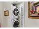Hallway view of stacked washer/dryer and bathroom doorway at 2794 Farmstead Se Rd, Smyrna, GA 30080
