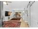 Open-concept living room with hardwood floors, natural light and dining area at 2794 Farmstead Se Rd, Smyrna, GA 30080