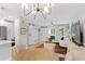 Bright living room showcasing modern lighting, dining area and sliding barn door at 2794 Farmstead Se Rd, Smyrna, GA 30080
