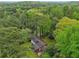An inviting home nestled among tall, mature trees, offering a serene and secluded retreat surrounded by nature's beauty at 3356 Thornewood Dr, Atlanta, GA 30340