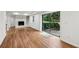 Spacious basement featuring luxury vinyl plank flooring, a brick fireplace, and sliding glass doors to the backyard at 3356 Thornewood Dr, Atlanta, GA 30340