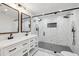 Modern bathroom featuring double sinks, white marble tile, and a glass-enclosed shower at 3356 Thornewood Dr, Atlanta, GA 30340