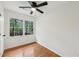 Bedroom features hardwood flooring and a window overlooking green trees at 3356 Thornewood Dr, Atlanta, GA 30340