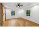 Spacious bedroom featuring hardwood floors, a modern ceiling fan, and abundant natural light at 3356 Thornewood Dr, Atlanta, GA 30340