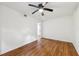 Bright bedroom featuring luxury vinyl plank flooring, a ceiling fan, and white walls and trim at 3356 Thornewood Dr, Atlanta, GA 30340