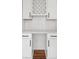 Butler's pantry featuring white shaker cabinets, quartz countertop and subway tile backsplash at 3356 Thornewood Dr, Atlanta, GA 30340