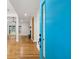 Bright blue front door, hardwood floors, and views of the living room and fireplace create a warm welcome at 3356 Thornewood Dr, Atlanta, GA 30340
