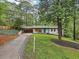 Charming, updated single Gathering home with a well-manicured lawn, mature tree, and beautiful landscaping at 3356 Thornewood Dr, Atlanta, GA 30340